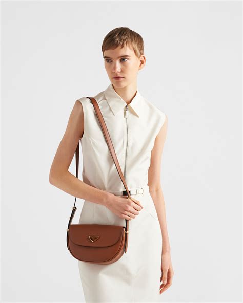 prada over the shoulder|Prada Arqué Leather Shoulder Bag With Flap.